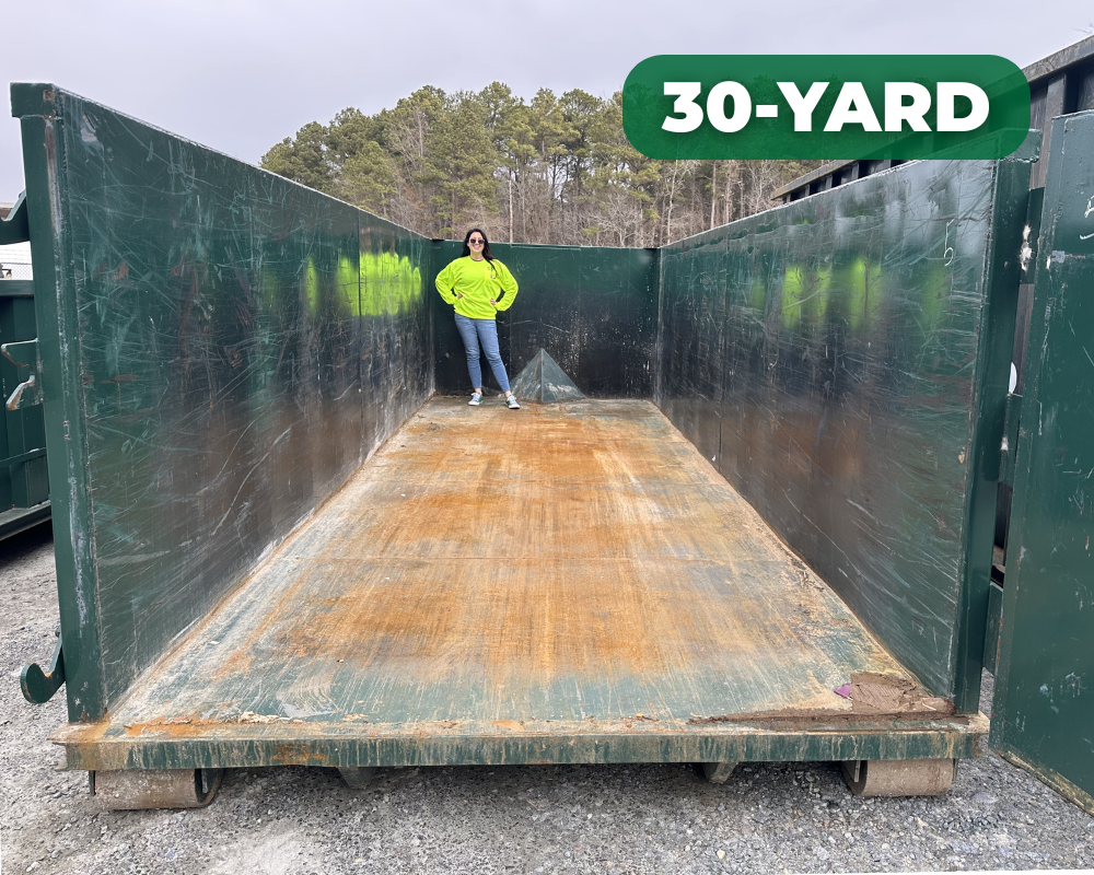 jen inside a 30 yard dumpster